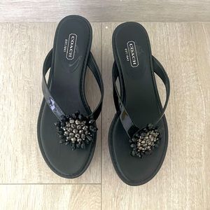 Coach black platform sandals.